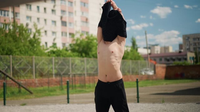 bold muscular display, selfassured man openly shows his physical prowess and confidence, an individual radiates confidence and demonstrates impressive muscular strength casually without shirt