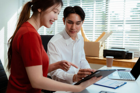 Teamwork process, Business team using a calculator to calculate the numbers of statistic business profits growth rate on documents graph data, desk in the office.