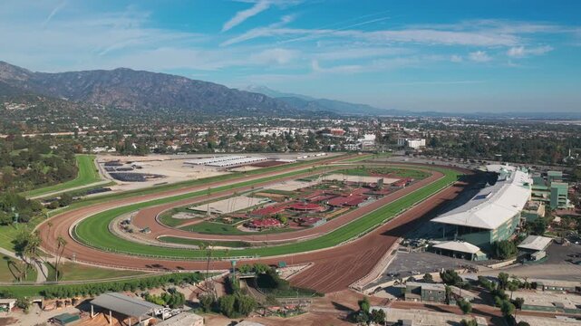 Wide panning aerial shot of the horse racetrack at Santa Anita Park in Los Angeles, California. 4K