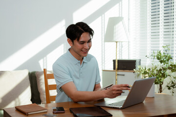 Lifestyle people, Mature male working with laptop and documents on desk, small business owner working online.