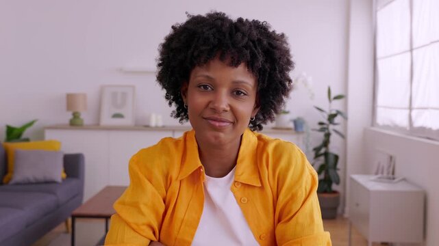 Front view webcam screen of young woman listening attentively during video call. She focuses on communication in a remote work or online learning environment. Business and education lifestyle.