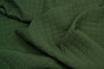 Fototapeta premium Quilted fabric. The texture of the blanket. Background to your project