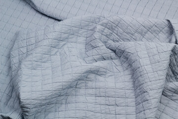Fototapeta premium Quilted fabric. The texture of the blanket. Background to your project