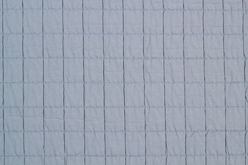 Fototapeta premium Quilted fabric. The texture of the blanket. Background to your project