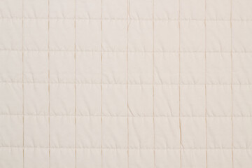 Fototapeta premium Quilted fabric. The texture of the blanket. Background to your project