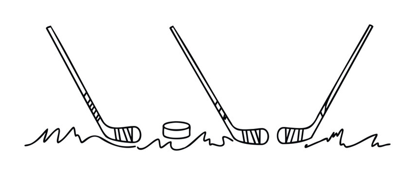 Hockey sticks and puck on rough ground symbolizing a game of ice hockey ready for action, perfect for sports themes and athletic promotion.