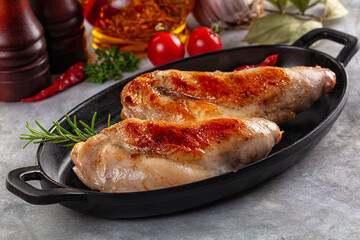 Roasted rabbit leg served rosemary