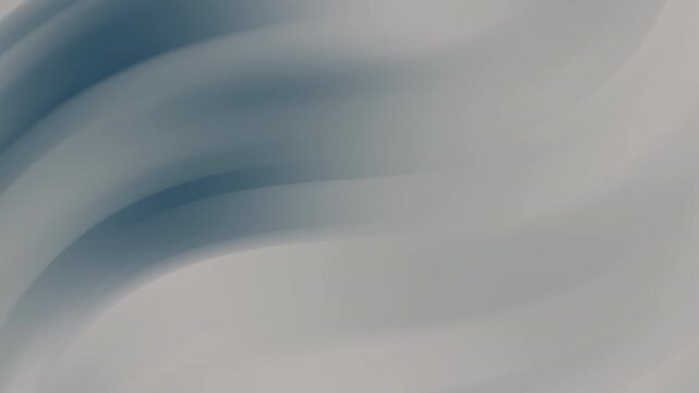 Soft gray and deep blue colors blend in smooth swirling waves. This abstract animation features fluid motion and a gentle lighting style