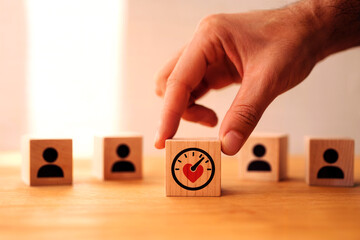 Customer Experience and Satisfaction Management Concept with Hand Selecting Heart Performance Indicator Among User Icons