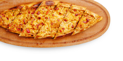 Delicious flatbread topped with cheese and tomatoes served on a wooden board