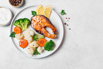 Healthy grilled fish salmon steak and vegetables