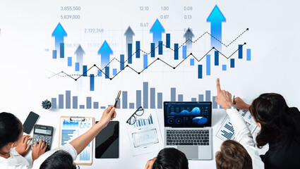 A group of business professionals collaborates on financial analysis using charts and graphs. They explore data trends and make strategic decisions for business growth. Scalp