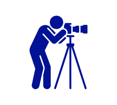 Silhouette of Photographer with Camera on Tripod Capturing Moments Through the Lens with Professionalism and Artistic Vision