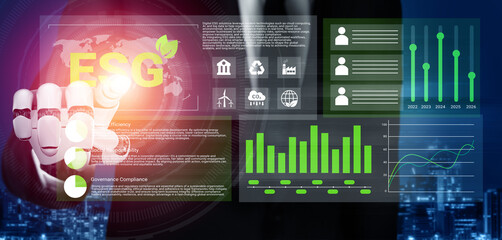 A businessman uses a digital interface displaying ESG analytics and data visualizations for informed investment strategies in a modern corporate setting. Gantry
