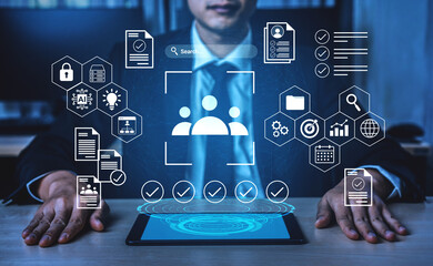 A businessman interacts with a digital interface showcasing icons that symbolize data analysis, security, and modern business strategies for effective decision-making. Gantry