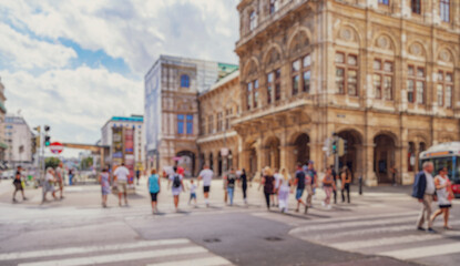 Obraz premium Crowd of anonymous people walking on busy city street 