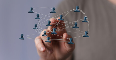 Hand touching network of people, concept of social connections and communication. Representing global access and remote teamwork and concept of