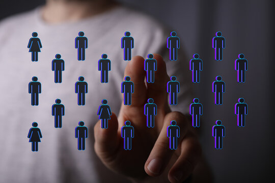 Hand touching digital people icons. Representing connection, networking, teamwork, and social media interaction