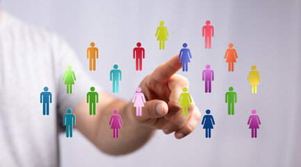 Visualize connection, community, and digital interaction with this image of a hand touching person icons. Represents teamwork, communication, an
