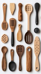 A collection of various wooden kitchen utensils, including spoons, spatulas, and scoops, arranged against a clean white background.
