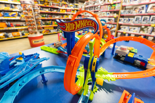 Colorful Hot Wheels track display in toy store