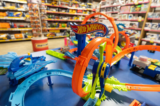 Colorful Hot Wheels track display in toy store