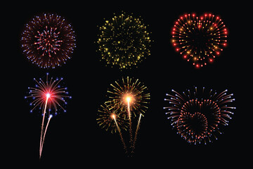 Colorful fireworks exploding in night sky.