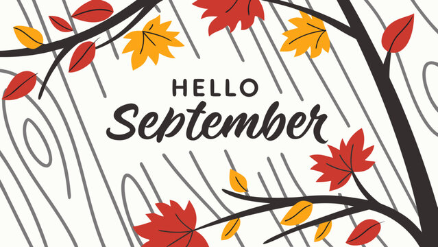 The phrase “HELLO SEPTEMBER” written in bold English style font, with colorful autumn leaves scattered on a rustic wooden background, celebrating cozy fall season 