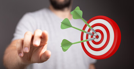 Image of darts hitting the bullseye on a target, representing goals, success, achievement, and...