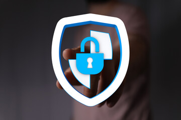 Concept of cybersecurity, data protection and secure access with a digital padlock on a shield representing protection and safety.