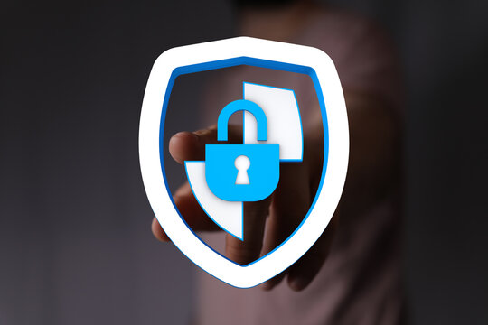 Concept of cybersecurity, data protection and secure access with a digital padlock on a shield representing protection and safety.