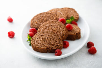 Dark chocolate swiss roll with raspberry