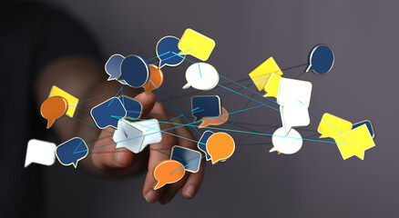 Hand reaching towards network of speech bubbles. Concept of communication, social media, connection, and data e