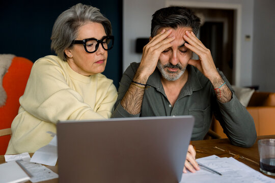 Couple worrying about finance and budget problems at home - Powered by Adobe