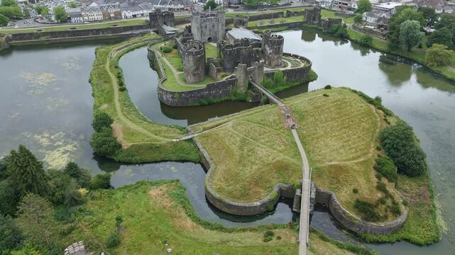 Aerial view showing the extensive stone walls and towers of medieval Caerphilly Castle