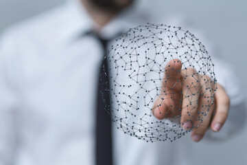 Business professional pointing at a digital network sphere, symbolizing global connection and technological advancements in modern world. Ideal