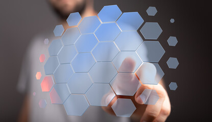 Abstract technology concept.  Person touching futuristic hexagonal grid. Innovation, connection, data.