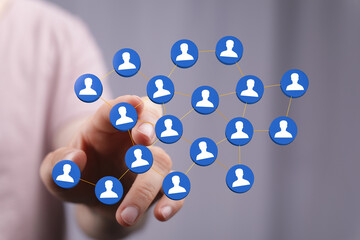 Hand touching network of people concept. Illustration of a network diagram showing connections between people a