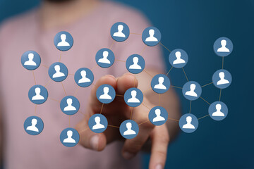 Hand touching network of connections depicting community, globalization, and business cooperation. Illustrating