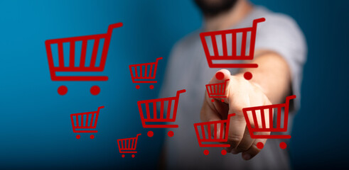 Person interacting with digital shopping carts, representing online shopping, e-commerce, and...