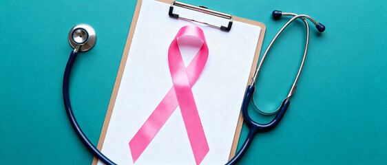 Pink ribbon on medical clipboard with stethoscope symbolizing cancer awareness, prevention, early detection, and healthcare support