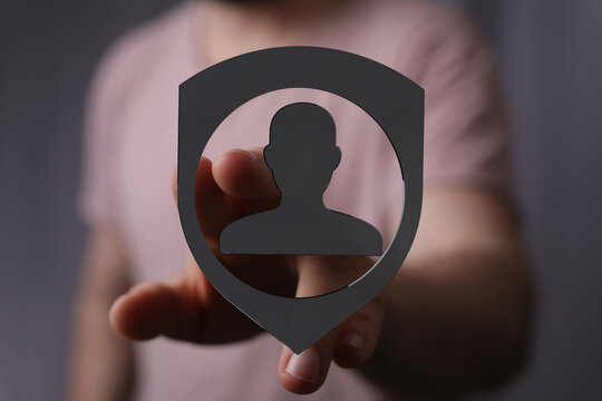 Abstract conceptual image depicting person within a shield symbolizing data protection privacy and digital secu