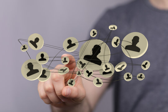 Hand pointing at digital social network interface. Connecting people and business online technology concept. - Powered by Adobe