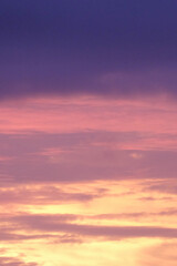 Abstract background gradient sunset sky in yellow, orange, purple and pink. Vertical image. For graphic design, 3D rendering and banners
