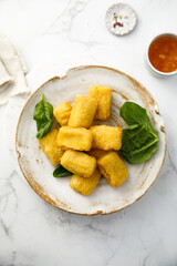 Fish nuggets with fresh spinach
