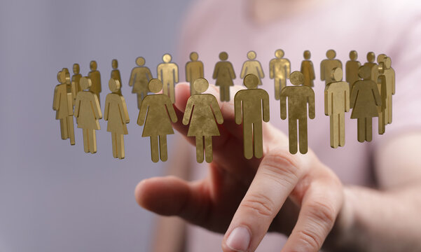 Hand reaching towards a circle of human figures, symbolizing unity, teamwork, and social interaction. Concept of community, connection, and coll