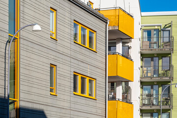 Modern architecture and urban housing in a residential area of Stockholm featuring Scandinavia facades and minimalism illuminated by clean light for a refined visual identity