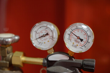 Detailed gauges display pressure readings in a modern gas setup with bright backdrop