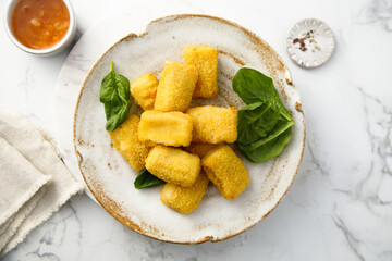 Fish nuggets with fresh spinach