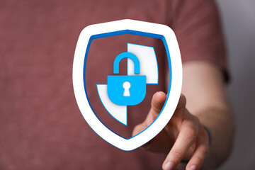 Concept of data security and protection with shield and lock symbol. Hand touching digital interface, cybersecurity and privacy with
